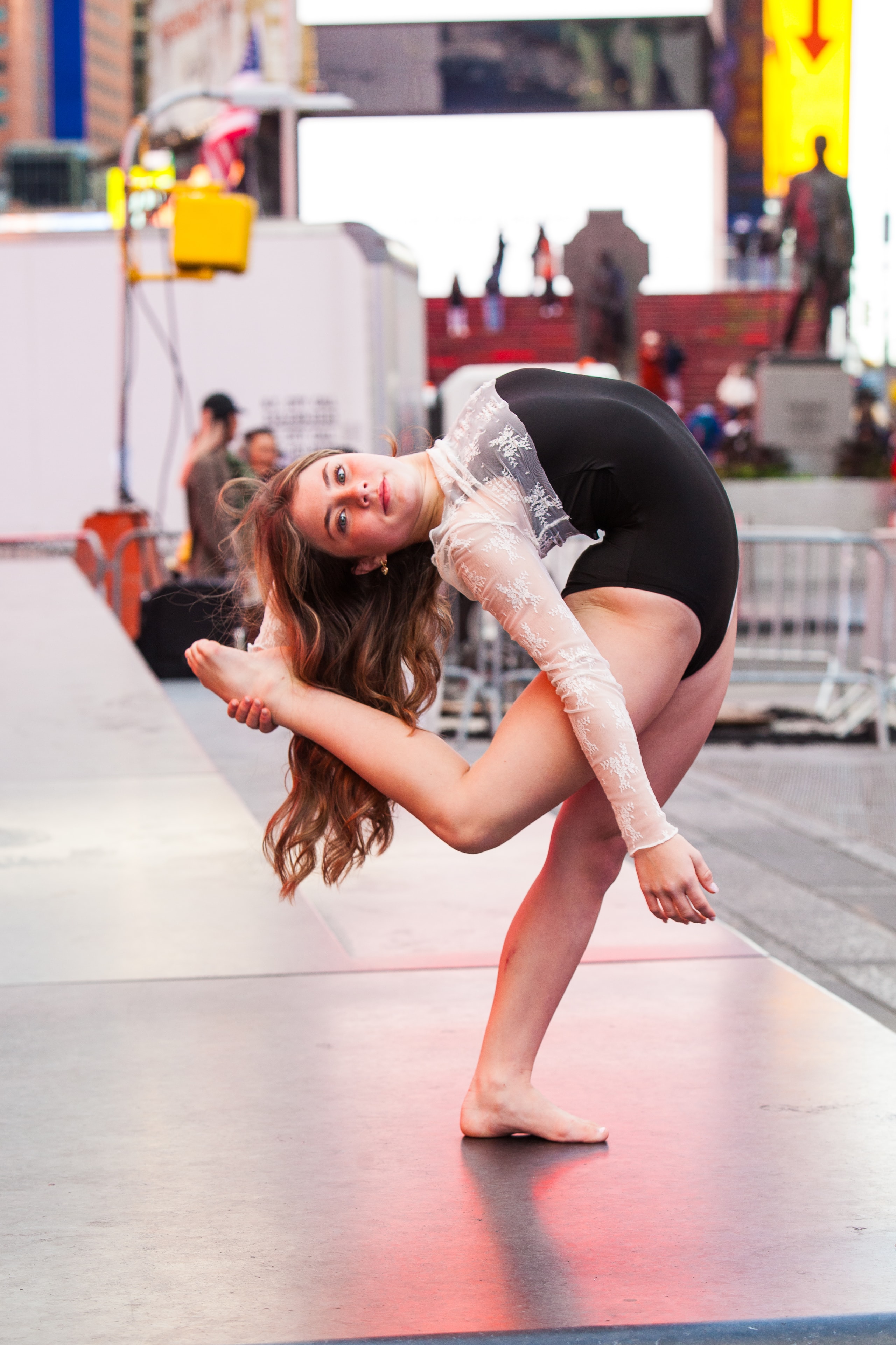 Dancer in a contortion pose in Times Square NYC