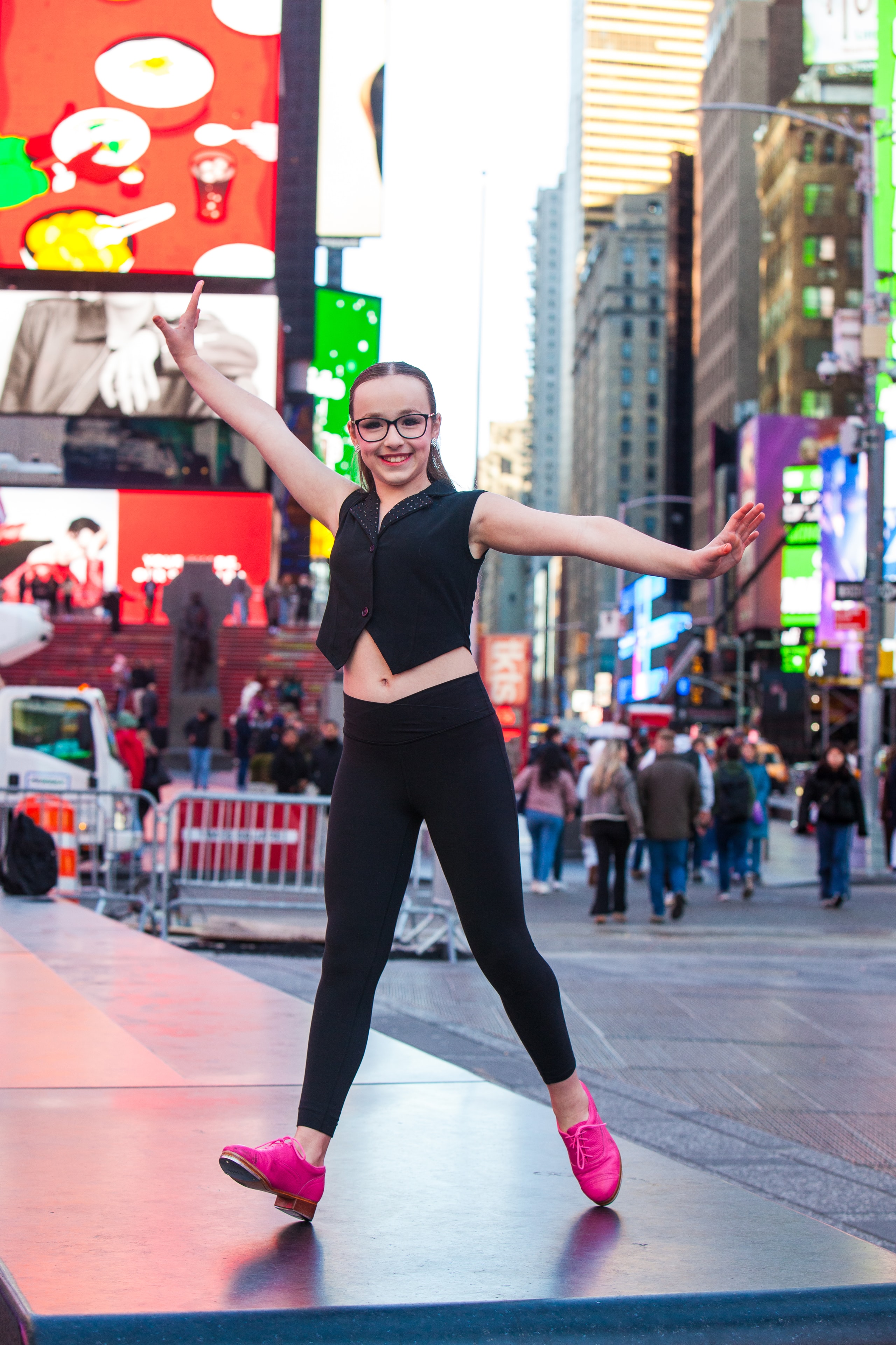Young dancer in jazz shoes performing in Times Square NYC